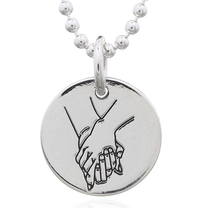 Holding Hand Gesture Sterling Silver Disc Pendant – Symbol of Bond