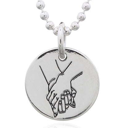 Holding Hand Gesture Sterling Silver Disc Pendant – Symbol of Bond